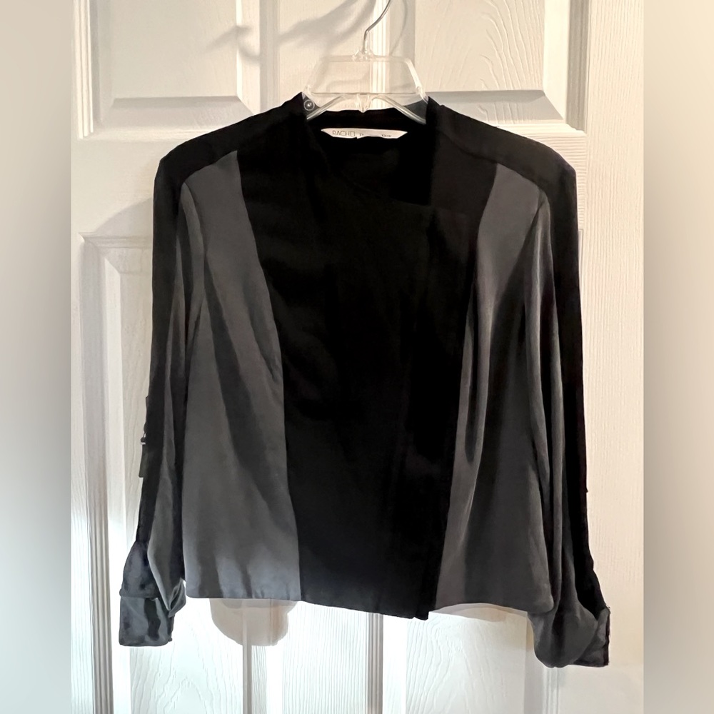 Cropped jacket with zipper. Buckle sleeve accent.